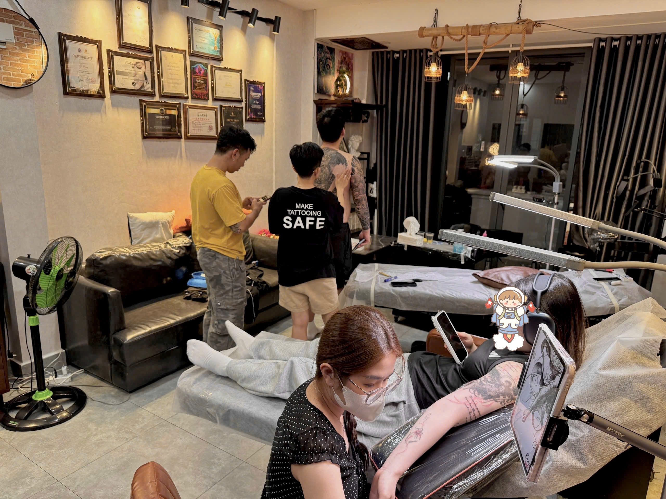 professional tattoo artist working with client in saigon studio
